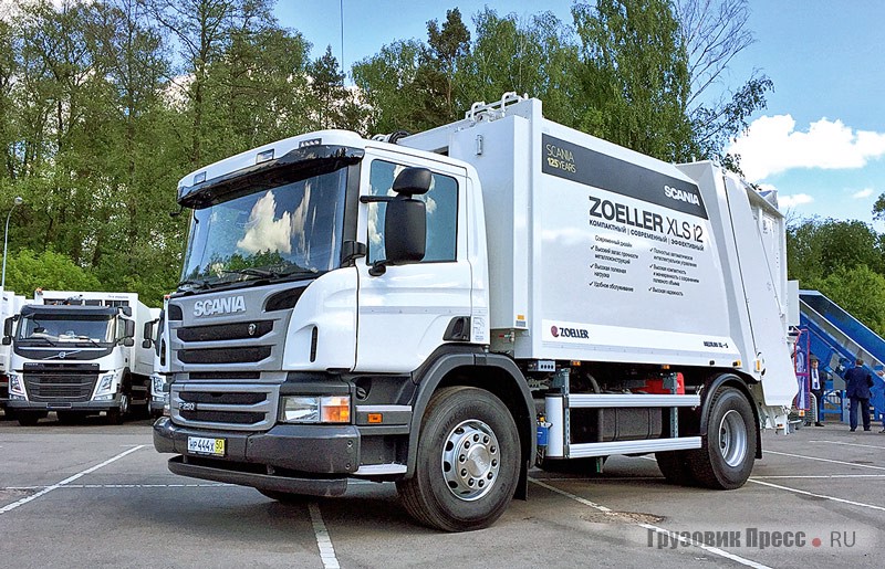 [b]Мусоровоз Zoeller XLC i2 на шасси Scania P250 4х2[/b] – эта машины представляет собой тщательно просчитанный компромисс между экономичностью и эффективностью. Объём кузова 17 м[sup]3[/sup], коэффициент прессования 1:7. Максимальная нагрузка на переднюю ось 8 т, на заднюю – 11,5 т. Двигатель DC09 102 мощностью 250 л.с. Коробка передач GR875 восьмиступенчатая с демультипликатором. Управление бункером осуществляется как из кабины, так и с правого и левого заднего борта. Камера заднего вида оснащена микрофоном, это позволяет не только обезопасить работу, но и сделать её более комфортной